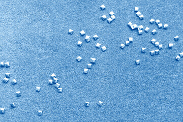 Gray paper background with shiny square beads