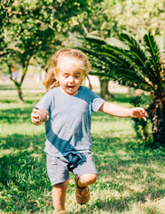 Fototapeta premium Girl running in garden