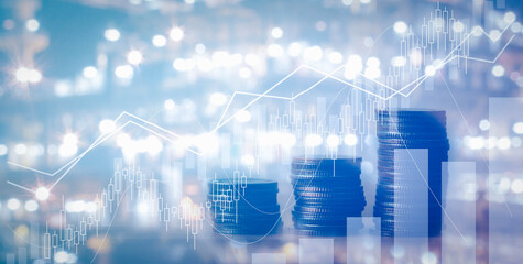 Close up of stacking of growth up coins with Double exposure of chart graph and night shift of oil and gas platform for finance and business ,capital banking and investment concept.