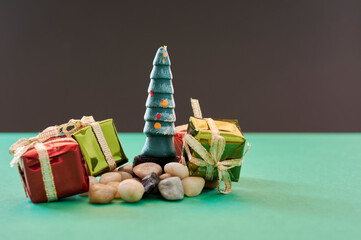 Christmas Decoration , some different christmas ornaments , on a green and black color background, in new normality