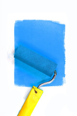 Painting a rough wall with roller. Paint roller leaving stroke of white color over a rustic background. usable for text and messages.