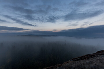 Fototapeta premium Moving clouds and autumn fog over the Black Forest
