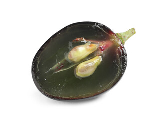 Half of delicious ripe dark blue grape isolated on white