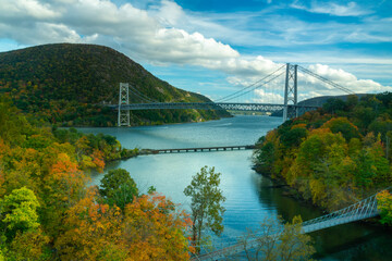 Fort Montgomery, NY / USA -Oct. 18, 2020: a wide angle view of the iconic Bear Mountain Bridge spanning the Hudson River. - obrazy, fototapety, plakaty