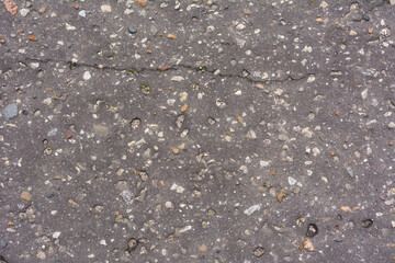 Texture of dry asphalt of gray color.