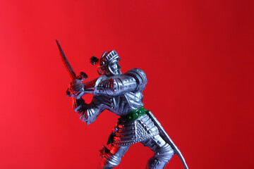 medieval knight toy on red background
