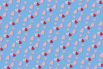 Fototapeta premium Creative Christmas pattern with New Year decorations. xmas Modern pattern made from christmas decorations. Blue background