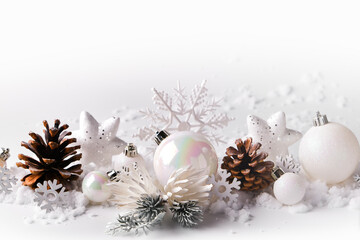 Fototapeta na wymiar Silver and white Christmas balls and ornaments on white snow background