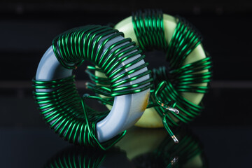 Electromagnetic Component Copper Inductors on Dark Background