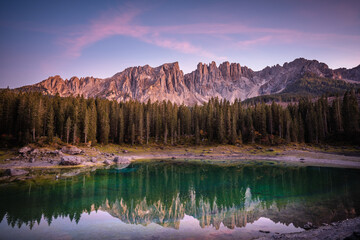 amazing mountains and lake at sunset time, with perfect reflection in Dolomites, Italy