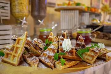 Assorted sweet cakes, small cakes on the table in a restaurant. small desserts. mix of small desserts. dessers for candy bar close up.