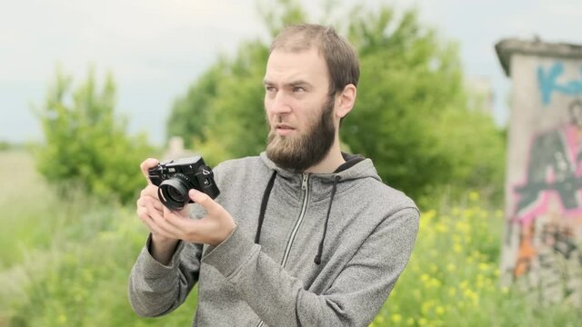 man taking photo with digital camera