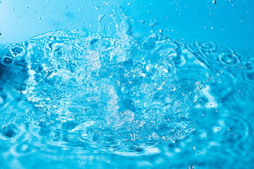 splash of water on a blue background. Abstract wallpaper