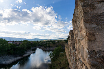 Fototapeta na wymiar Rock wall, sky and river