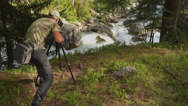 Caucasian Men Taking Nature Place Photos Using Modern Camera and Tripod