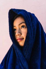 caucasian girl covered by a blanket