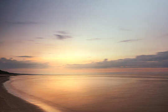 beautiful seascape at sunset, golden hour, long exposure