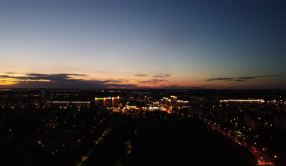 Top view of the night city at sunset