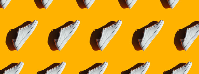 Banner for a website with a pattern of white sneakers.