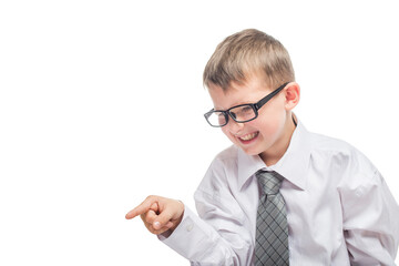 Little cute boy in a shirt and a tie points a finger forward and yells. Angry young businessman is screaming