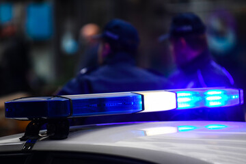 Blue light on a police car - obrazy, fototapety, plakaty