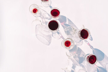 Wine of different varieties in glasses on a white background.