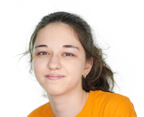 Portrait of a young girl in an orange t-shirt on a white background