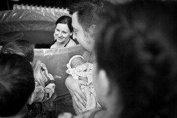 Happy Family Celebrating Newborn Baby After Home Birth