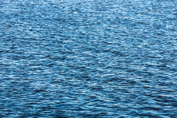 Ocean wave background. Bubble water foam backdrop. Turbulent sea texture. Messy water flow. Ripples on lake water.