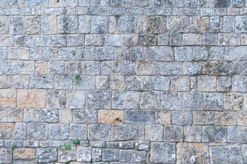 Old wall texture. Granite stone bricks pattern, natural construction material 