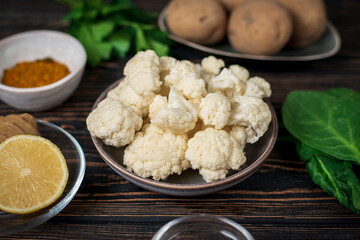 Aloo Gobi Ingredient set. Traditional spicy vegetarian indian curry dish with potatoes, cauliflower, spinach with spices
