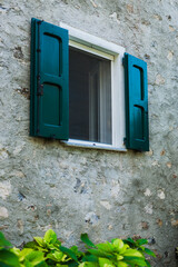 Mediterranean Window with Green Shutters