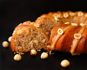 Holiday homemade cakes with hazelnut on dark background. Big delicious appetizing homemade muffin...
