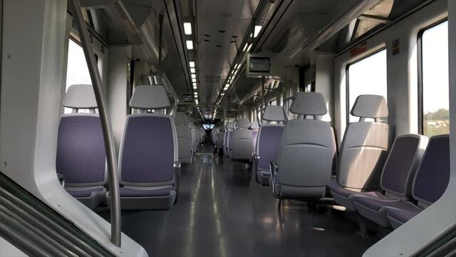 Empty train carriage moving inside view