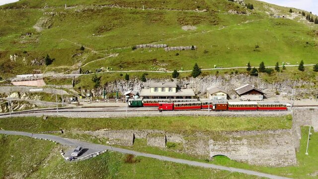 Famous cog railway on the mountain Schynige Platte in Switzerland - a popular tourist attraction