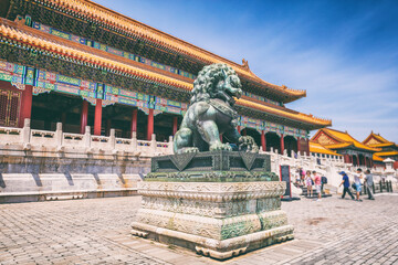 China travel destination background Beijing city famous ancient building architecture old temple with metal lion statue. Summer Asia vacation.