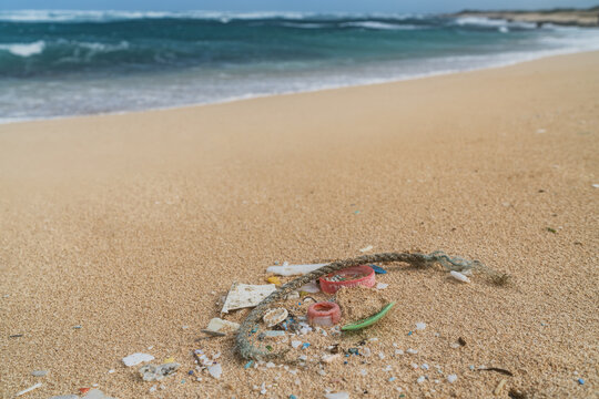 Beach Cleanup Of Plastic Fragments Pollution From The Ocean. Marine Debris In Hawaii.