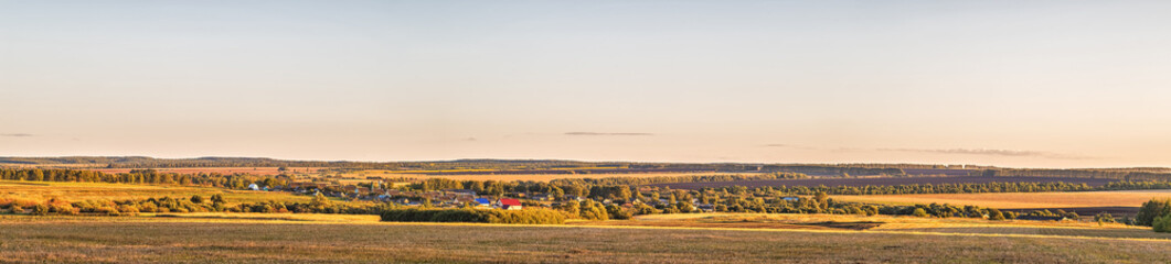 Panoramic image of a small rural settlement.