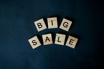 The inscription big sale from wooden blocks