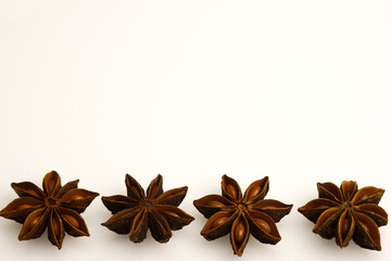 Four star anise on a clean white clipping background. Close-up photographed.