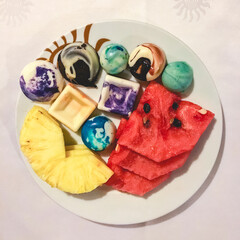 Buffet dessert of fine chocolates, pineapple and watermelon slices