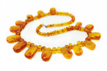Necklace made of natural amber isolated on a white background. Beautiful jevelry for woman	