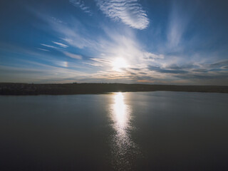 Sunset over a river with forest on a horizon. Almost dusk.