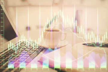 Double exposure of financial chart drawing and desktop with coffee and items on table background. Concept of forex market trading