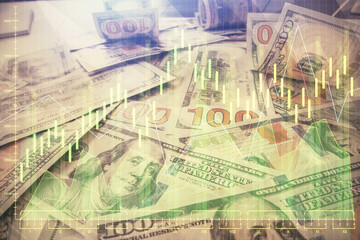 Multi exposure of forex chart drawing over us dollars bill background. Concept of financial success markets.