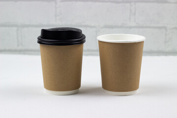 Brown coffee mock up on blank background for design any ideas. Paper mug cup template for cafe or restaurant create identity set.