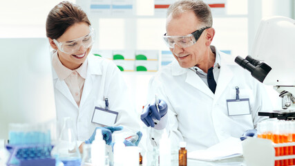 close up. scientists discussing samples sitting at a laboratory table.