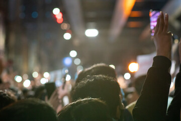 Abstrack blurred night group of rotesters show symbolic gestures at Bangkok to protest against the government 2020