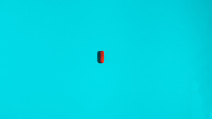 Pharmaceutical medicine pills, tablets and capsules on coral background. Medicine concept.