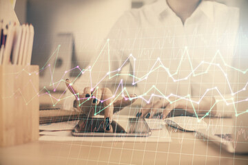 Double exposure of forex chart sketch hologram and woman holding and using a mobile device. Financial market concept.